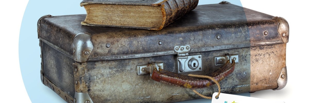 Old book on a suitcase Old book on a suitcase